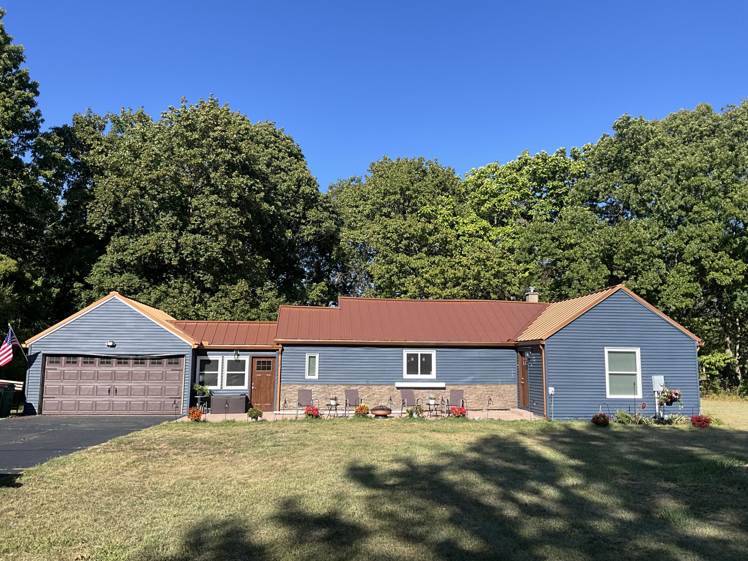Professional exterior house painting project in Grand Rapids, MI, showcasing a beautifully updated home.